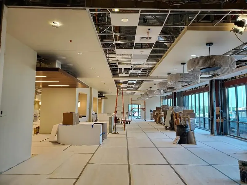 Commercial interior renovation with finished ceilings and flooring