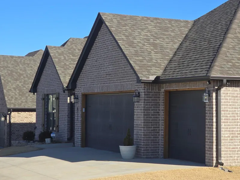 Residential roof and brick exterior